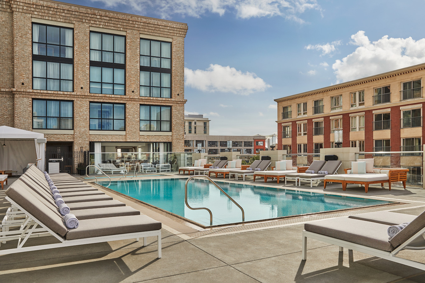 Sun loungers beside the rooftop pool at Pendry San Diego